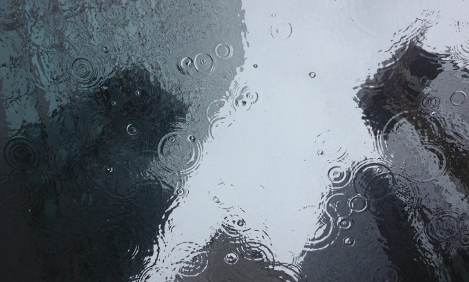 reflection of buildings on a flooded street